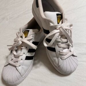 Adidas White Sneakers with Black Stripes and Gold Logo